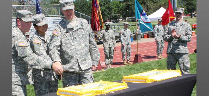 cutting the cake during the Army's 240th birthday.